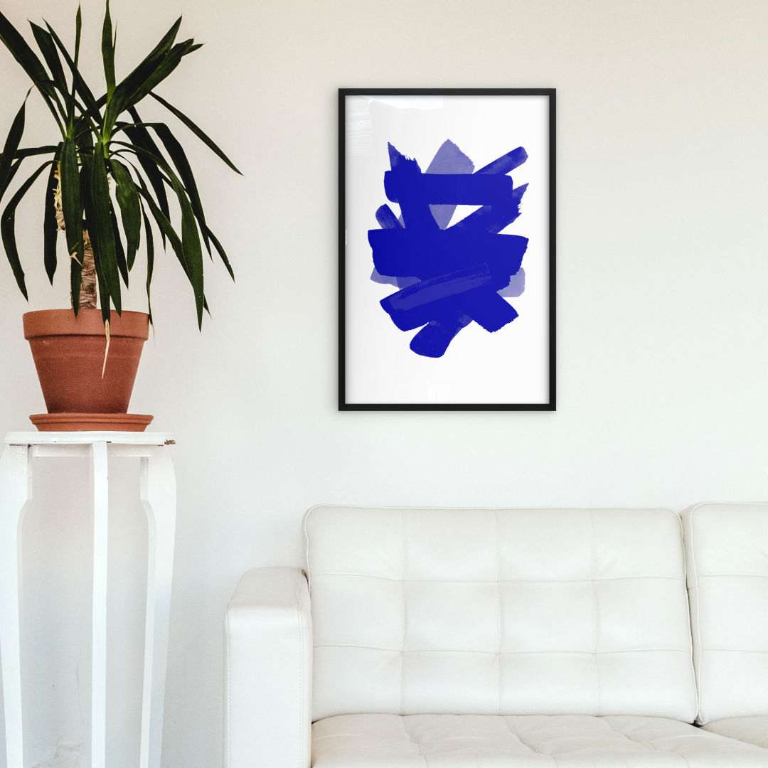Mockup image of framed artwork featuring navy brush strokes expertly hand-painted to create a unique and dynamic abstract design. The deep hues of blue evoke a sense of calm and serenity, making it a perfect addition to any living space or office. Professionally framed in sleek black, this high-quality print adds a touch of elegance to any interior style.