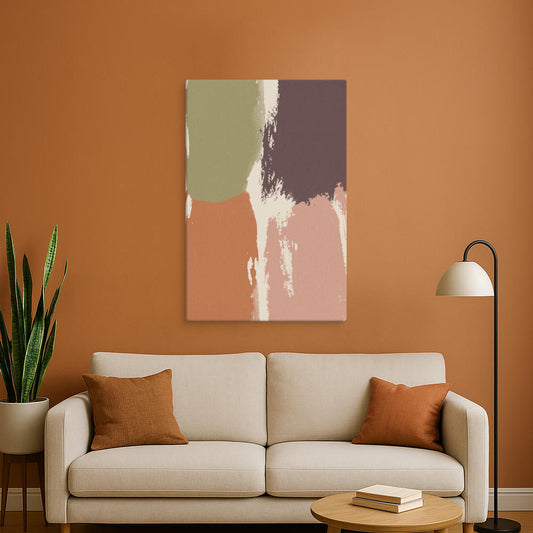 A warm-toned abstract canvas print in brown, beige, and muted green shades is displayed above a cozy cream-colored sofa. The earthy orange accent wall provides a rich backdrop, making the artwork seamlessly blend with the room's natural aesthetic.