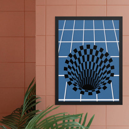 A 3D optical illusion art print in a white frame displayed on a terracotta or coral-colored wall. The print features a black checkered vortex pattern against a blue grid background, creating the illusion of a deep hole. A green plant leaf is visible in the bottom left corner.
