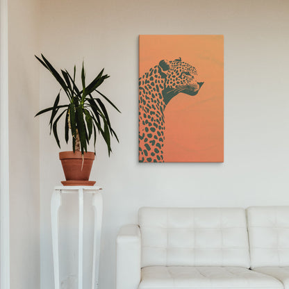 Dusk Cheetah canvas print hung above a white sofa with a potted plant, ideal for minimalist and nature-inspired living room decor.