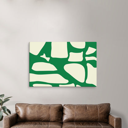 A modern green and white abstract canvas print brings a lively energy to a cozy seating area. The fresh green tones contrast with the neutral brown sofa, creating a balanced and inviting atmosphere.