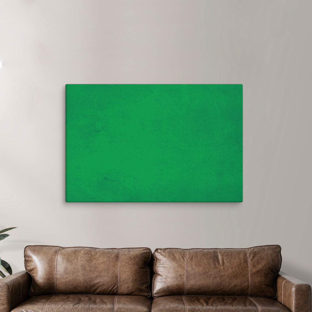 
Pantone green abstract canvas print displayed above brown leather sofa in modern living room. Perfect living room pictures for contemporary home decor and gallery wall inspiration.