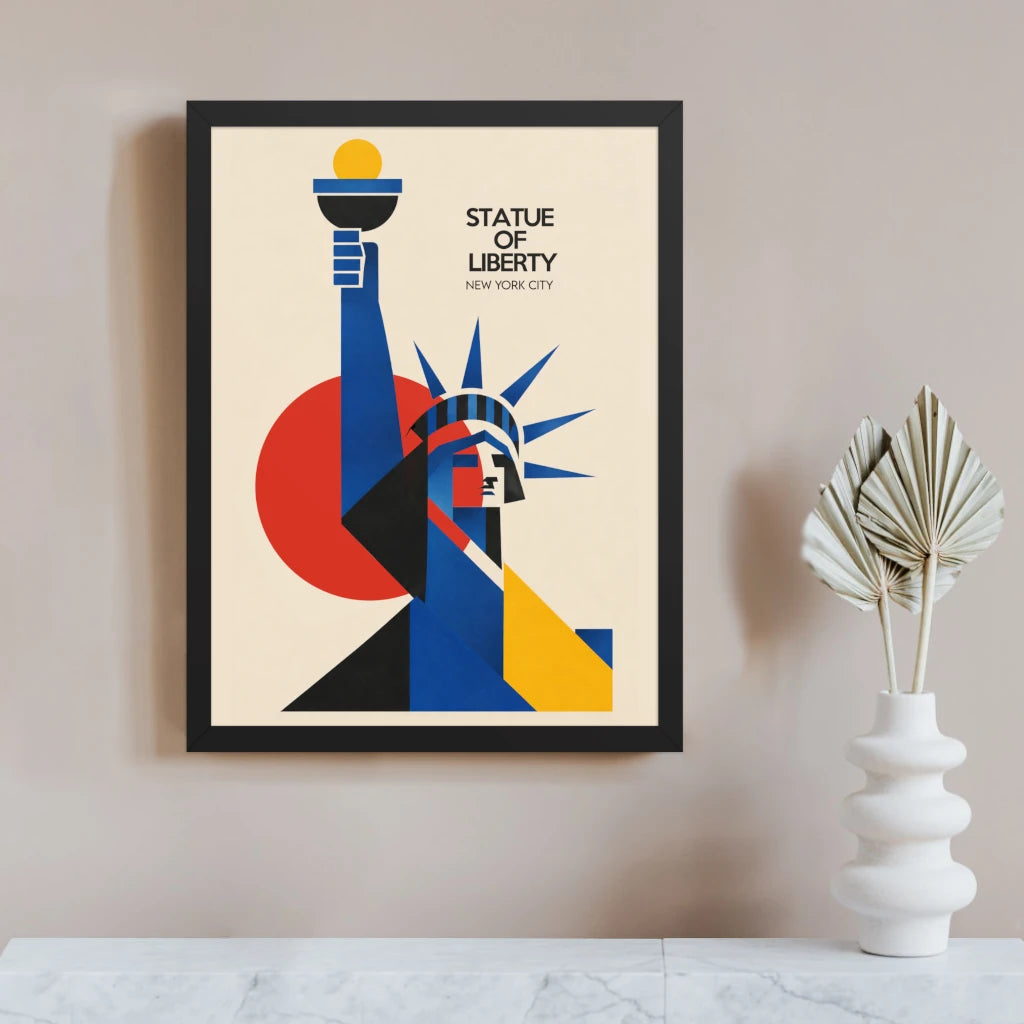 Bauhaus Statue of Liberty poster in a black frame, with the raised torch and crown built from blue, black and yellow geometric forms against a large red circle on a cream background.