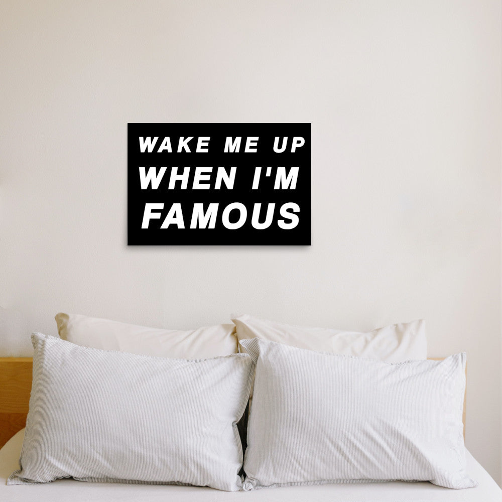 wake me up when i'm famous poster on bedroom wall 