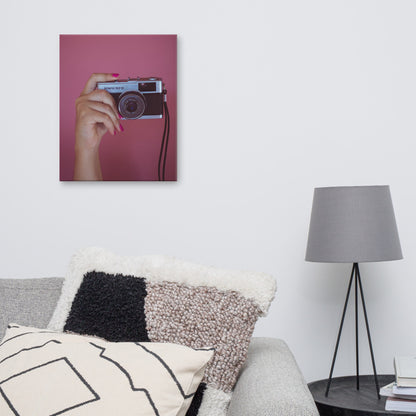 mock-up of camera in hand - pink background