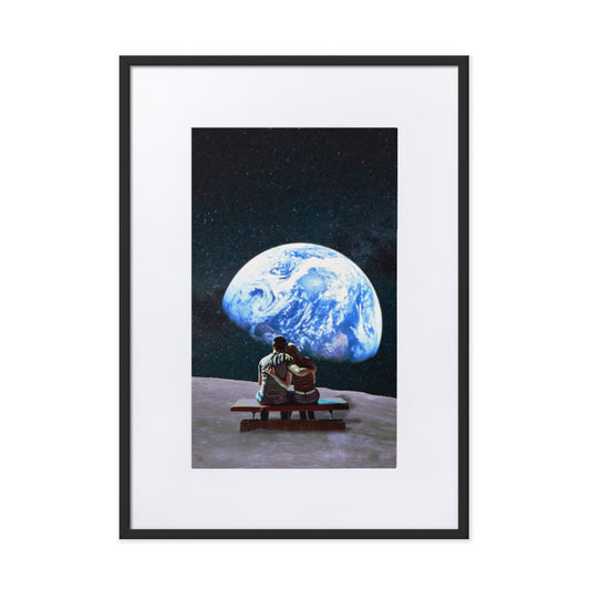 framed wall art of couple sitting on moon observing earth